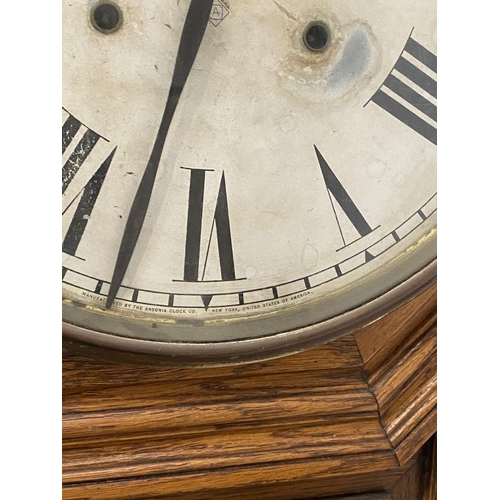 24 - A FINE AMERICAN ANSONIA WALL CLOCK, with white dial, roman numerals to clock face, reading ‘Manufact... 