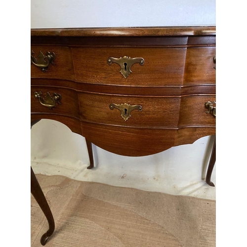 240 - A FINE MAHOGANY SHAPED LOW BOY, shaped top above two drawers with brass handles, on cabriole leg. Di... 