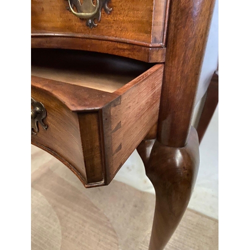 240 - A FINE MAHOGANY SHAPED LOW BOY, shaped top above two drawers with brass handles, on cabriole leg. Di... 