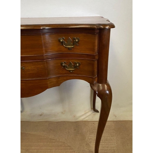 240 - A FINE MAHOGANY SHAPED LOW BOY, shaped top above two drawers with brass handles, on cabriole leg. Di... 