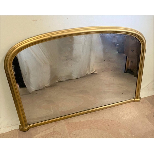 242 - A VICTORIAN GILT OVERMANTLE MIRROR, of arched form with fluted gilt frame. Dimensions: 136cm x 83cm ... 