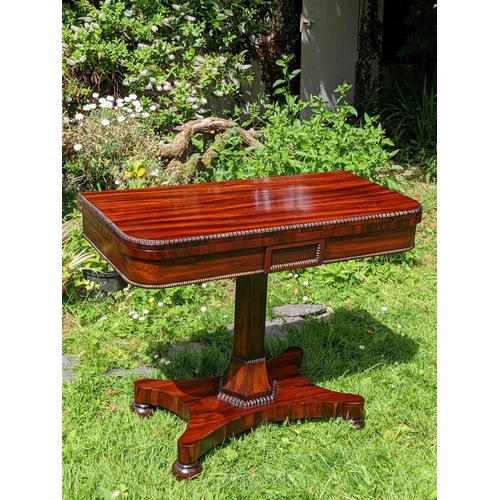 244 - A VERY FINE REGENCY ROSEWOOD FOLD OVER CARD TABLE, the rounded body decorated with gadrooned detail ... 