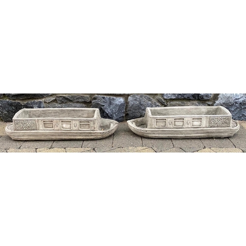 246 - A PAIR OF STONE GARDEN PLANTERS, in the form of boats, reading ‘Lucy Anne’ with floral designs to si... 