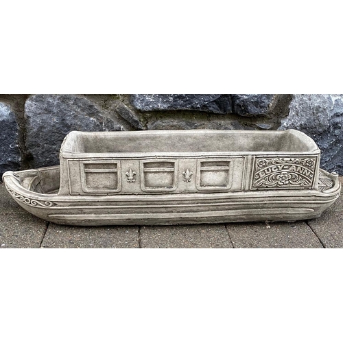 246 - A PAIR OF STONE GARDEN PLANTERS, in the form of boats, reading ‘Lucy Anne’ with floral designs to si... 