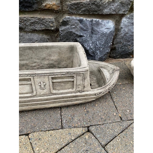 246 - A PAIR OF STONE GARDEN PLANTERS, in the form of boats, reading ‘Lucy Anne’ with floral designs to si... 