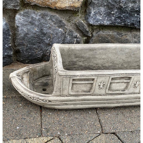 246 - A PAIR OF STONE GARDEN PLANTERS, in the form of boats, reading ‘Lucy Anne’ with floral designs to si... 