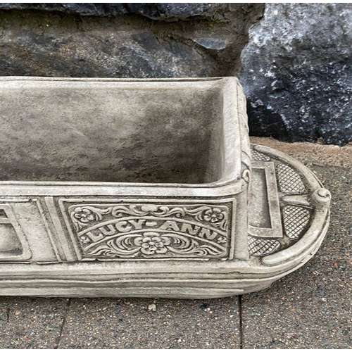 246 - A PAIR OF STONE GARDEN PLANTERS, in the form of boats, reading ‘Lucy Anne’ with floral designs to si... 