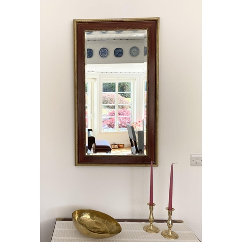 25 - A LOVELY ANTIQUE SWEDISH WALL MIRROR, rectangular form with bevelled glass within ornate deep red fr... 