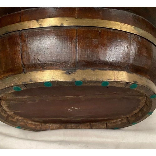 257 - AN ANTIQUE IRISH JARDINIERE/PLANT STAND, oval form with double brass banding and liners. Dimensions:... 