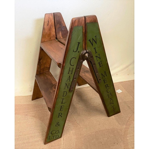 258 - A PINE STEP LADDER, two steps, with advertising to sides. Dimensions: 44cm x 60cm high approx