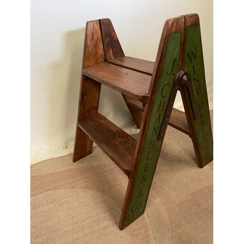 258 - A PINE STEP LADDER, two steps, with advertising to sides. Dimensions: 44cm x 60cm high approx