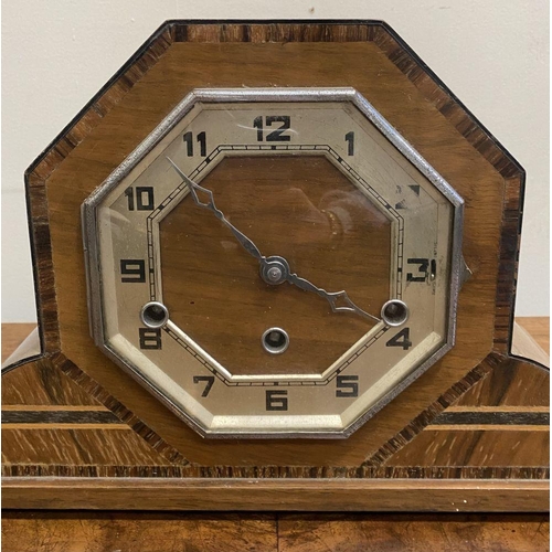 262 - AN ART DECO HARDWOOD INLAID MANTLE CLOCK, octagonal form with fine crossbanded details, on base with... 