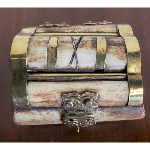 264 - A UNIQUE BONE AND BRASS BOUND JEWELLERY BOX, brass binding shaped box, with engraved clasp.