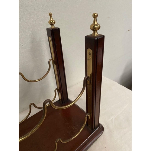 268 - A GOOD BRASS & MAHOGANY WINE RACK, with decorative gilt brass finials atop supports on mahogany rect... 