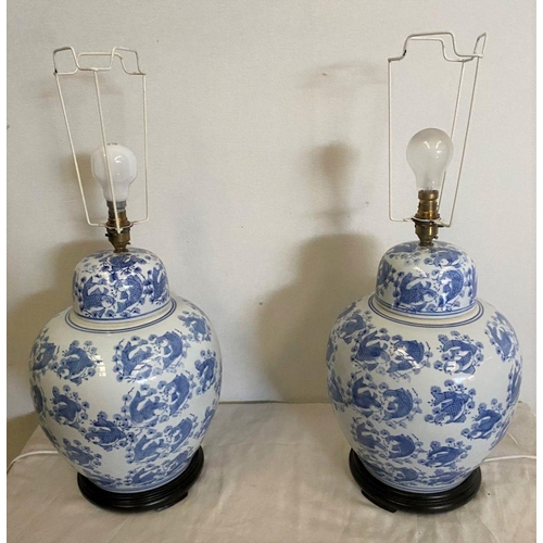 272 - A LARGE PAIR OF CHINESE GINGER JAR LAMPS, bulbous form with blue painted design depicting coy fish o... 