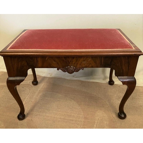 277 - AN IRISH WALNUT COFFEE TABLE/STOOL, upholstered to top, shell carving to frieze, with cabriole leg o... 