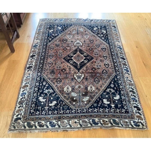 279 - A FINE ANTIQUE PERSIAN QASHQHAI CARPET, c.1900, central diamond motif within multiple borders filled... 