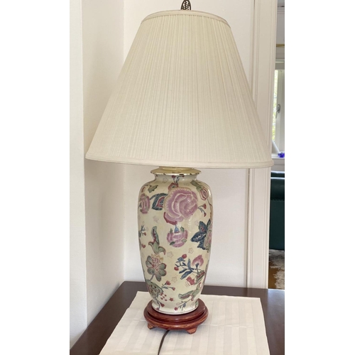 282 - A PAIR OF VINTAGE ORIENTAL CERAMIC TABLE LAMPS, finely decorated with painted floral design on cream... 