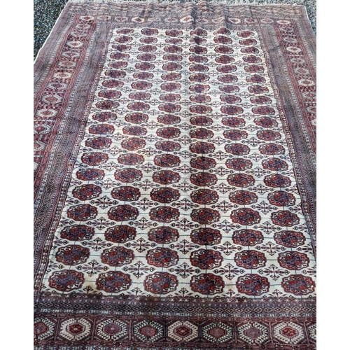 284 - AN EXCELLENT AUTHENTIC TURKOMAN RUG, with traditional design featuring repeat motif design to centre... 