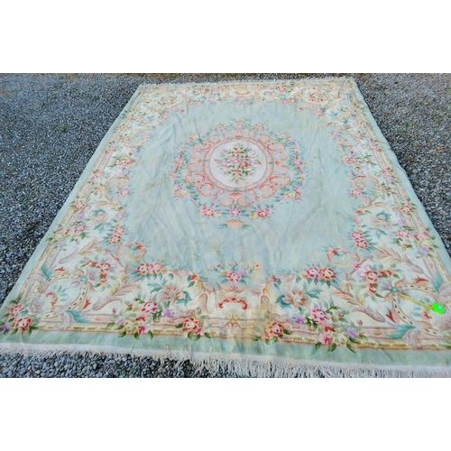 285 - A TRADITIONAL CHINESE MEDALLION RUG, with central floral medallion surrounded by vibrant floral bord... 