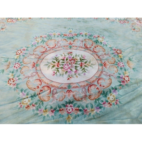 285 - A TRADITIONAL CHINESE MEDALLION RUG, with central floral medallion surrounded by vibrant floral bord... 