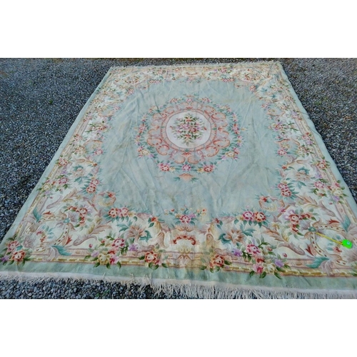 285 - A TRADITIONAL CHINESE MEDALLION RUG, with central floral medallion surrounded by vibrant floral bord... 