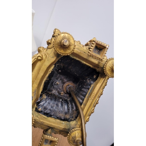 288 - A PAIR OF HEAVY PATINATED BRONZE & GILT CAST TABLE LAMPS, each with a small figure, one holding a mu... 