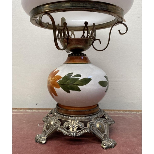 30 - A VINTAGE PAINTED GLASS HURRICANE LAMP, with shaped brass frame and base, finely decorated standing ... 