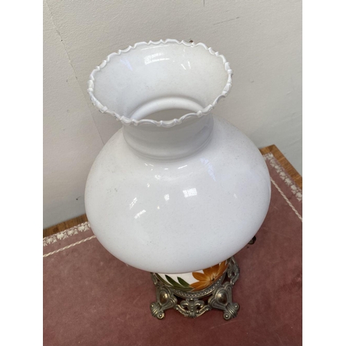 30 - A VINTAGE PAINTED GLASS HURRICANE LAMP, with shaped brass frame and base, finely decorated standing ... 