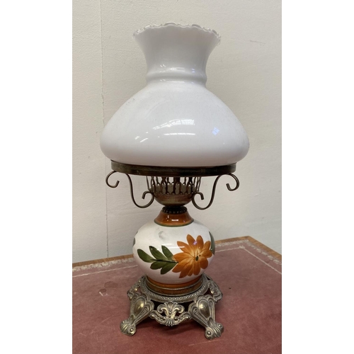 30 - A VINTAGE PAINTED GLASS HURRICANE LAMP, with shaped brass frame and base, finely decorated standing ... 