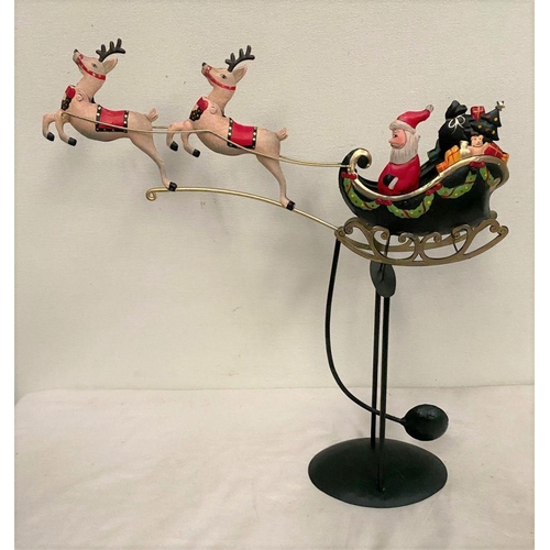 300 - A CHARMING CHRISTMAS PENDULIM, on circular platform base with Santa in sleigh and two reindeers. Dim... 