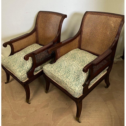 307 - A GOOD QUALITY PAIR OF MAHOGANY FRAMED BERGERE ARMCHAIRS, having shaped backs and arms with bergere ... 