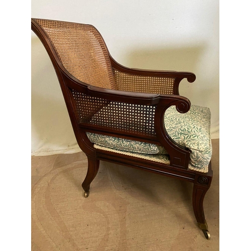 307 - A GOOD QUALITY PAIR OF MAHOGANY FRAMED BERGERE ARMCHAIRS, having shaped backs and arms with bergere ... 