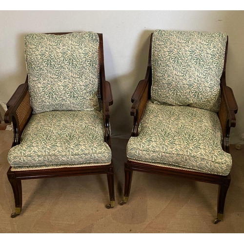 307 - A GOOD QUALITY PAIR OF MAHOGANY FRAMED BERGERE ARMCHAIRS, having shaped backs and arms with bergere ... 