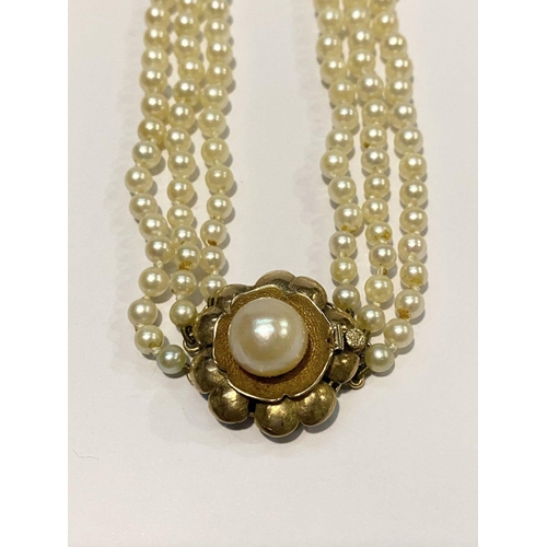 312 - TWO LOVELY PEARL NECKLACES, (i) one strand with 14ct gold clasp with green enamel to centre, (ii) a ... 