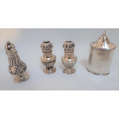 317 - A PAIR OF SILVER PEPPERETTES, Hallmarked Birmingham 1893, along with another similar silver pepperet... 