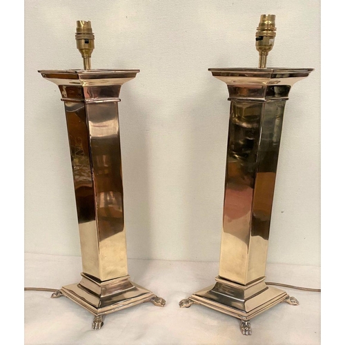 35 - A FINE PAIR OF POLISHED BRASS TABLE LAMPS, column form on square platform base with four lion paw fe... 