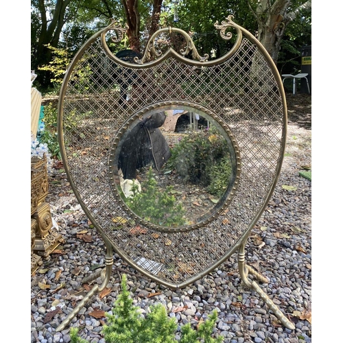 36 - A 19TH CENTURY UNIQUE MIRRORED FIRESCREEN, of cartouche/crest form, with circular bevelled glass to ... 