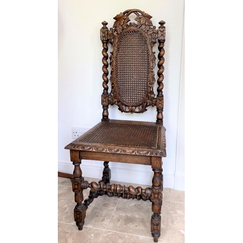 38 - AN ANTIQUE OAK CARVED JACOBEAN CHAIR, with woven seat and oval panel to backsplat, surrounded by orn... 