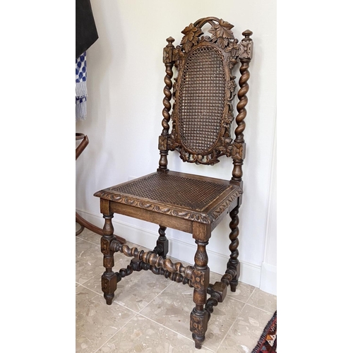 38 - AN ANTIQUE OAK CARVED JACOBEAN CHAIR, with woven seat and oval panel to backsplat, surrounded by orn... 