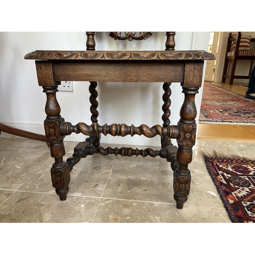 38 - AN ANTIQUE OAK CARVED JACOBEAN CHAIR, with woven seat and oval panel to backsplat, surrounded by orn... 