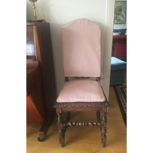 38 - AN ANTIQUE OAK CARVED JACOBEAN CHAIR, with woven seat and oval panel to backsplat, surrounded by orn... 