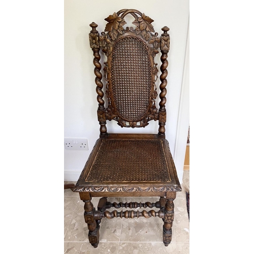 38 - AN ANTIQUE OAK CARVED JACOBEAN CHAIR, with woven seat and oval panel to backsplat, surrounded by orn... 