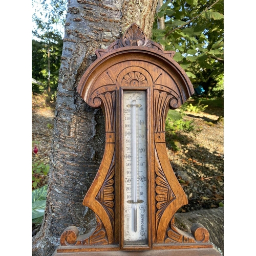 48 - AN ANTIQUE MCPHERSON BROTHERS GLASGOW WHEEL BAROMETER, in finely carved hardwood frame. Dial reading... 