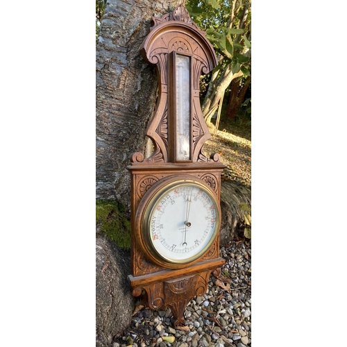 48 - AN ANTIQUE MCPHERSON BROTHERS GLASGOW WHEEL BAROMETER, in finely carved hardwood frame. Dial reading... 