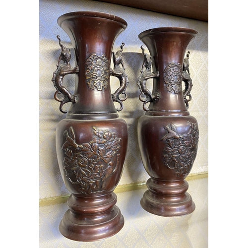 54 - AN ANTIQUE PAIR OF BRONZE CHINESE VASES, late 19th Century, baluster form, finely decorated with rel... 