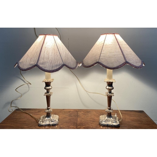 59 - A PAIR OF FINE SILVER PLATED TABLE LAMPS, turned column supports with floral scrolling decoration, s... 