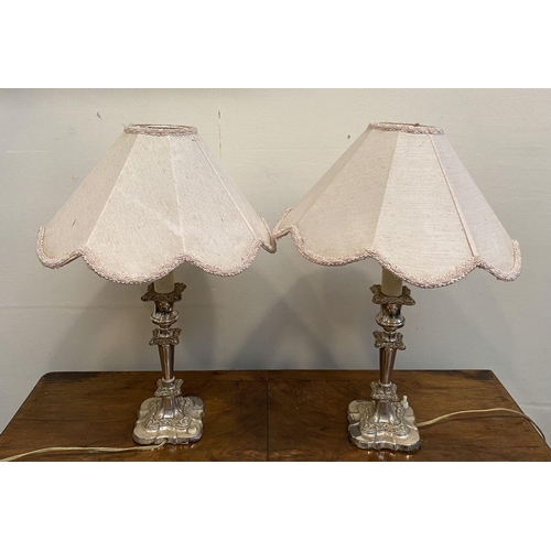 59 - A PAIR OF FINE SILVER PLATED TABLE LAMPS, turned column supports with floral scrolling decoration, s... 