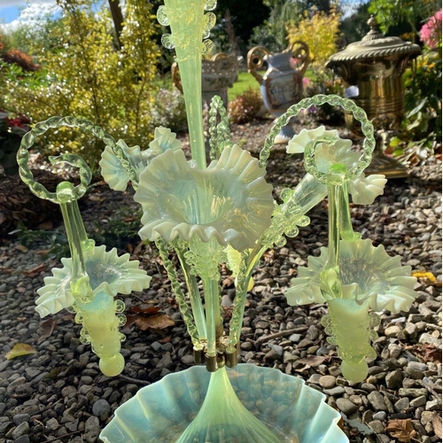 62 - A WONDERFUL VICTORIAN GLASS EPERGNE, with ruffled base supporting three horns and three hanging bask... 