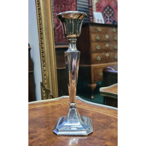 64 - AN EARLY 20TH CENTURY SILVER CANDLE STICK BY HENRY WILLIAMSON, maker's mark of H.W.Ld for Henry Will... 